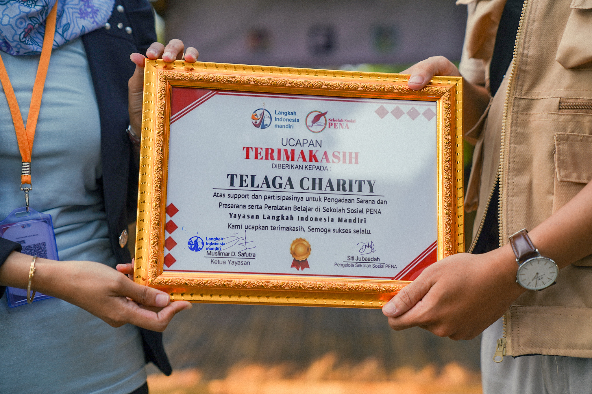 Certificate ceremony at a Telaga Charity school event